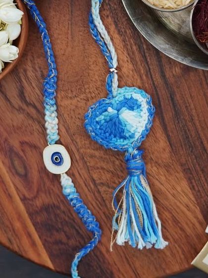 The blue Lumba and Rakhi combo, featuring an evil eye charm for protection. A thoughtful and stylish choice.