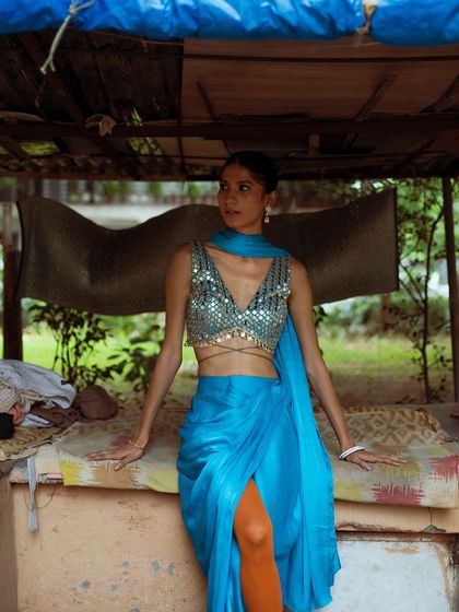 A street style fashion shoot, combining a glamorous, mirror-work top with a rustic, everyday setting. I love this contrast.