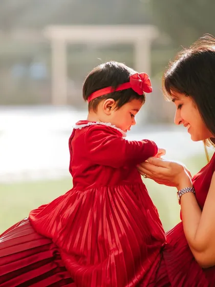 When your family is growing, we make sure to include everyone in the story. This mother and child portrait captures the sweet bond with an older sibling, making the maternity session a memory for the whole family.