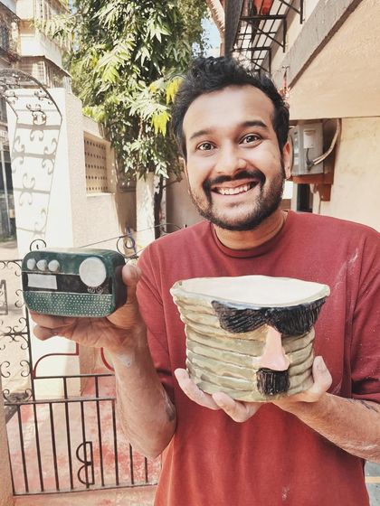 This student started with a one-time workshop and came back to begin his pottery journey. His pieces, like the quirky radio and the massive planter, are full of fun and character.