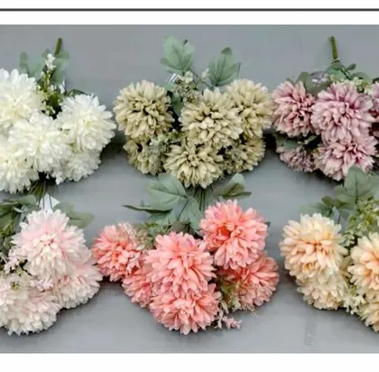 Artificial chrysanthemum bunches in a variety of pastel and neutral shades, including white, beige, and light pink.