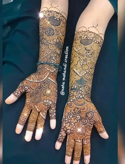 A full-coverage bridal design with a mix of Indian and floral elements. The details are very fine, which gives a very rich and traditional look.