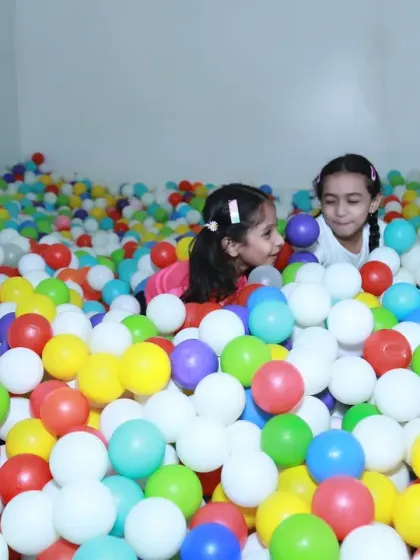 The absolute chaos and fun of a birthday party. I love diving right into the action, capturing the energy and laughter of kids at play. This shot from a ball pit is a perfect example of the candid, joyful moments I look for during event photography.