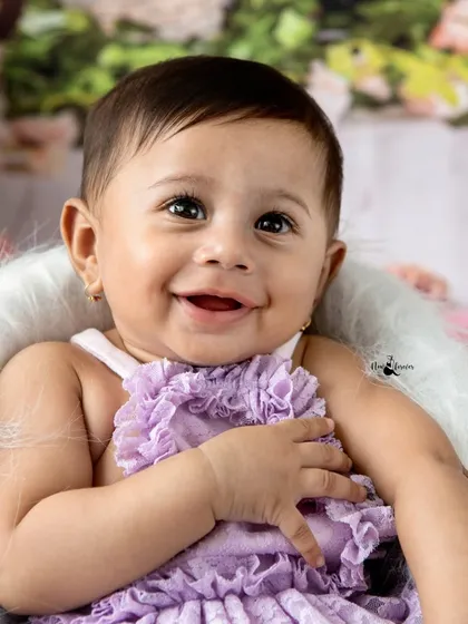 Look at that heart melting smile. This is from a six month sitter session, a perfect milestone to capture when babies can sit up and their personalities truly begin to shine. Adira's happy expression made this floral themed shoot an absolute joy.