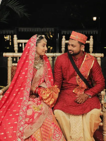 A quiet moment together during the ceremony. The couple looks serene and happy, and the bride's makeup enhances her natural beauty.