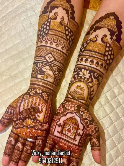 I love creating these grand, royal-themed designs. This Rajwada style mehndi features majestic elephants, proud peacocks, and a doli scene, all brought together with intricate patterns. It’s a statement piece for the bride who wants to feel like a queen.