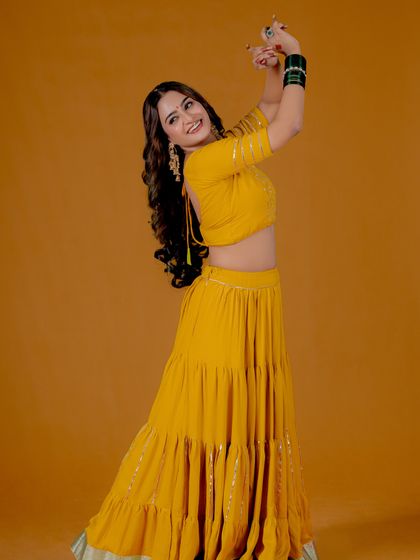 A full-body shot capturing a dance-like movement, showcasing the fluidity of the fabric. I love to incorporate motion to make fashion photography feel alive.