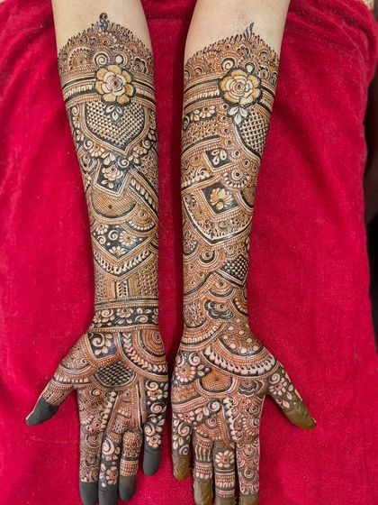 A gorgeous engagement design featuring a single, prominent rose at the top of the arm, with flowing patterns that draw the eye downwards.