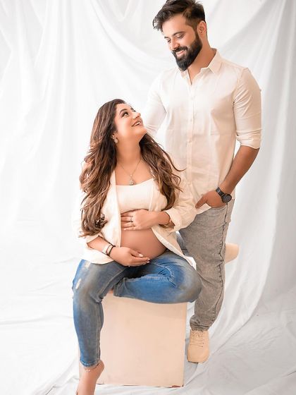 Another variation of a casual seated pose, capturing the couple's loving interaction. I guide my clients into poses that feel comfortable and look beautiful.
