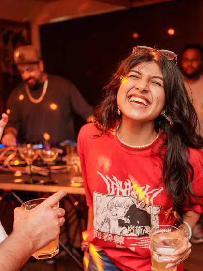 A guest laughing and dancing right in front of the DJ booth. This is the kind of energy that fuels my sets.