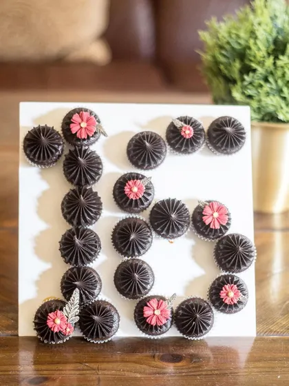 Milestone birthdays deserve a special treat. These are mini chocolate cupcakes arranged to form the number 16 for a sweet sixteen party. I can create any number or letter with mini or regular-sized cupcakes in the flavour of your choice.