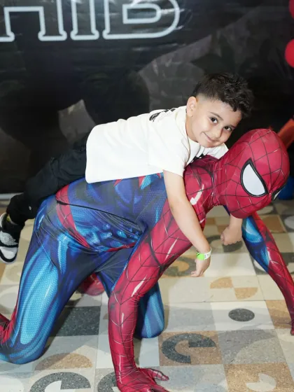 Imagine the look on your child's face when their favorite hero shows up! We arrange for live character mascot appearances, like this moment with Spider-Man, to create truly magical and interactive birthday memories.