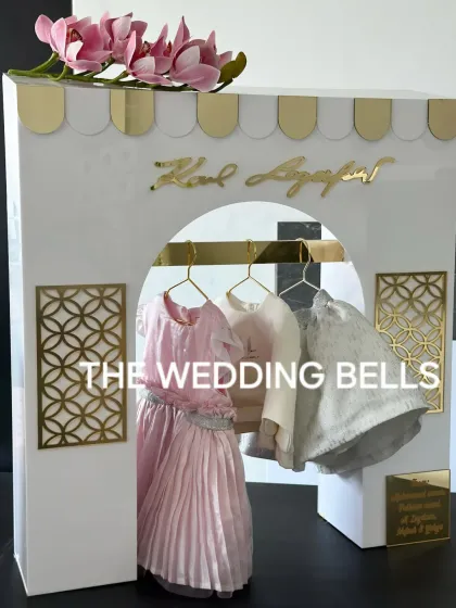 For a little fashionista, we designed this grand and luxurious Karl Lagerfeld-themed display for her clothes. It's chic, modern, and incredibly stylish.