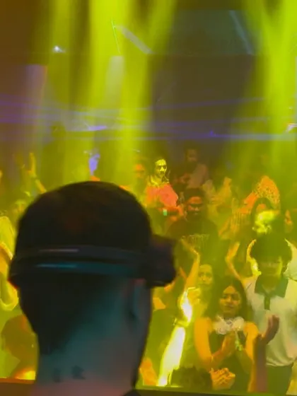 A view from behind my shoulder at Ginza, with the crowd bathed in yellow light. It shows the intimate connection between the DJ and the audience.