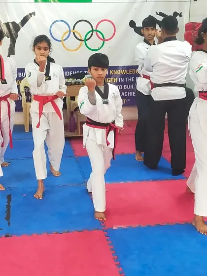 Our red belt students performing their Poomsae in unison during the black belt test. Synchronization and precision are key elements we look for.