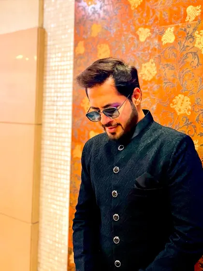 A stylish, looking-down pose. It's all about the attitude and the confidence.