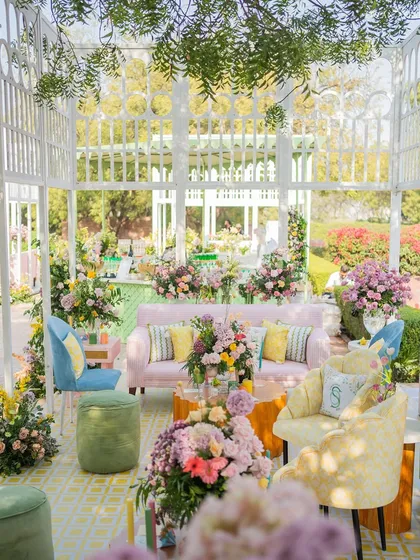 A view from inside one of the lounges, looking out into the garden, showing the layers of color and texture in the design.