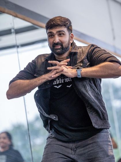 A student nailing a hip-hop pose. My classes cover a range of styles, ensuring that everyone finds something they love.