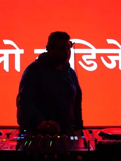 A powerful silhouette against a blazing red background with my name in Hindi. This is one of my signature shots, all about the vibe.