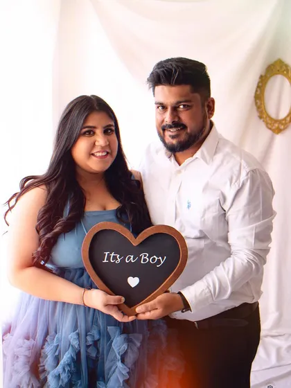 A classic "It's a Boy!" announcement portrait. The couple's happy smiles say it all in this simple and sweet pregnancy photo.