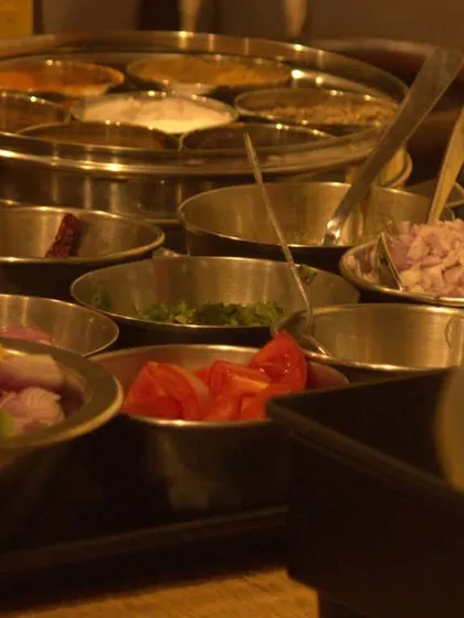 The 'mis en place' for our Ayurvedic cooking class. Freshly chopped vegetables, aromatic spices in a traditional masala dabba, and other wholesome ingredients are ready to be transformed into a healing meal.