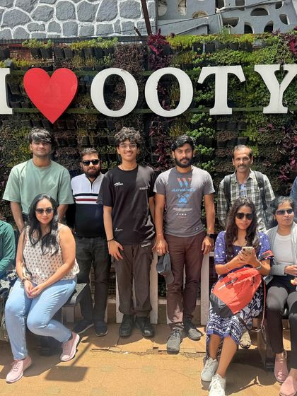 Posing at the "I Love Ooty" sign. It's a classic photo spot to commemorate a wonderful trip to the Queen of Hill Stations.