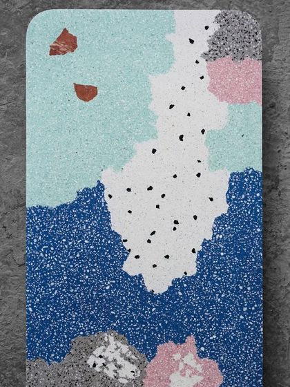 A top-down view of a multicolor terrazzo sample, resembling an abstract painting. This design can be used for tabletops, wall art, or even unique flooring tiles.