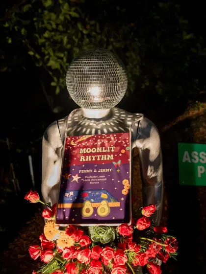 A "Moonlit Rhythm" sign, held by a mannequin with a disco ball head. This quirky signage perfectly captured the cosmic, party-centric theme of the sangeet night.