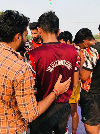 A quick strategy talk during a timeout. I am giving instructions to the team during a crucial moment in a tournament match.