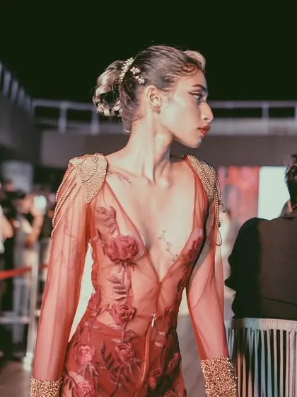 A model on the runway at our URBN fashion night. The event provides a platform for designers to showcase their collections to a live audience in a vibrant, energetic setting.