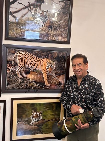 Another one of my framed photographs on display. Holding my 400mm lens next to the print shows the power of this gear to capture images worthy of being hung on a wall.