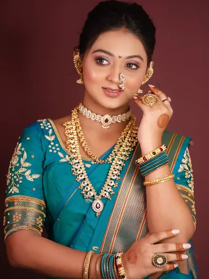 Another angle from the portfolio shoot, highlighting the layered jewelry and how it complements the makeup.