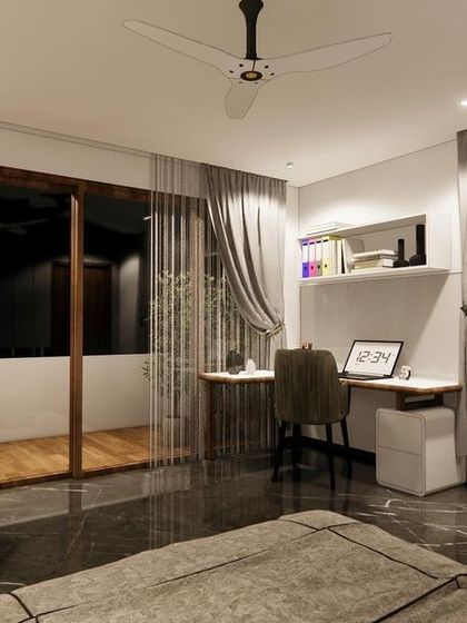 This corner of the bedroom is designed as a functional study nook. The wingback chair offers a comfortable spot for reading, and the large windows are framed with elegant grey curtains.