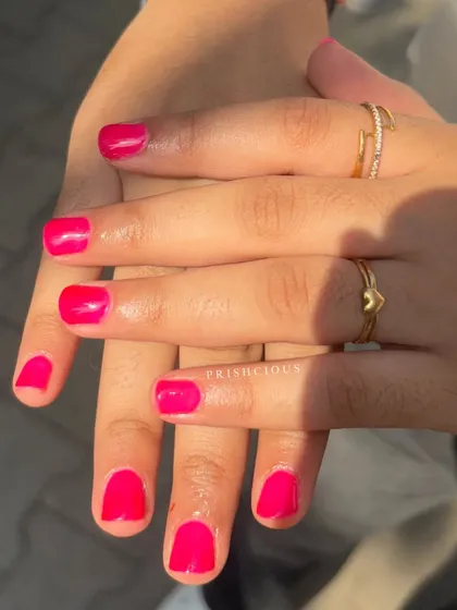 Feeling hot, feeling pink! A vibrant and fun hot pink gel polish on short, natural nails. A pop of color is always a good idea.