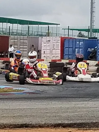 Our drivers battling for position on a challenging section of the track, demonstrating the skill and confidence gained through our program.
