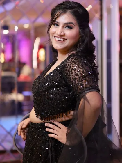 Another beautiful shot of this glamorous black lehenga look. The makeup is designed to be picture-perfect.