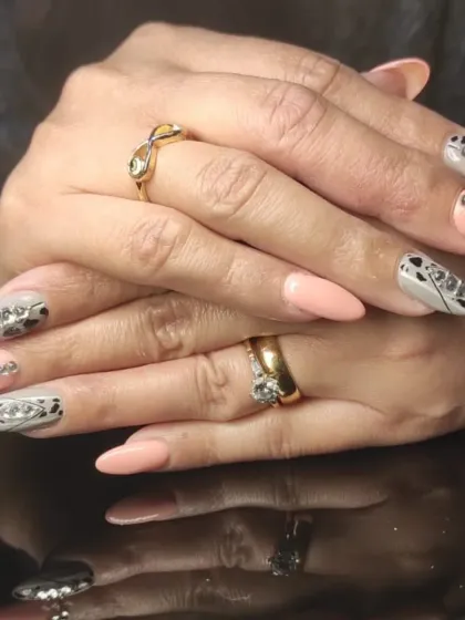 A full view of the creative and glamorous animal print and rhinestone manicure.