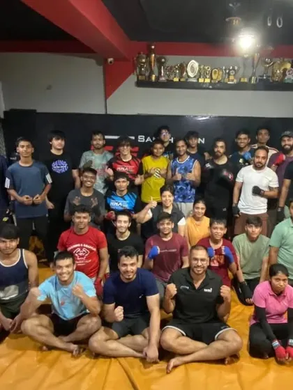 A group photo of our diverse team, including kids, adults, men, and women. MMA FitZone is a place for everyone to train and grow.