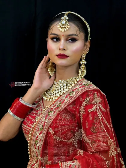 A classic red bridal lehenga paired with elegant, defined makeup is a look that never goes out of style. I create sophisticated looks that feel both modern and timeless, focusing on grace and poise.