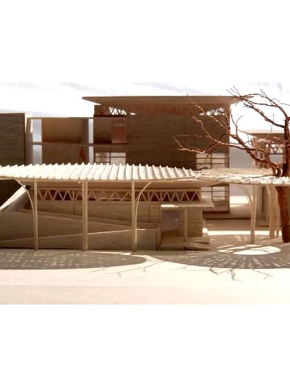 A model view of the inclusive and welcoming entry to the school. The gentle ramps and wide overhangs are studied here to ensure they create the intended accessible and inviting gesture.