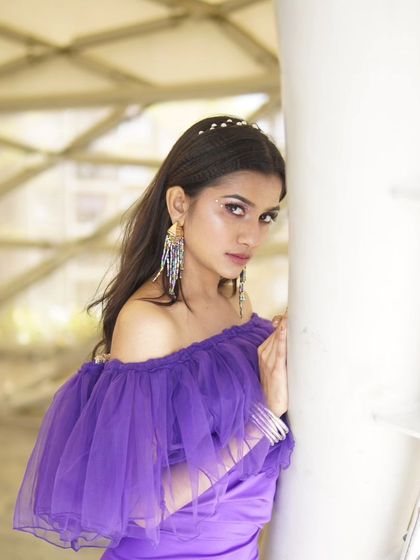 A close-up view of the makeup for the purple gown shoot. I used a soft, shimmery eyeshadow with a defined liner to make the eyes stand out, keeping the rest of the face clean and polished.