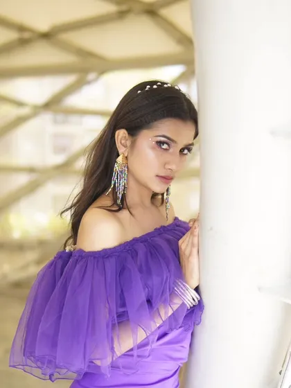 A close-up view of the makeup for the purple gown shoot. I used a soft, shimmery eyeshadow with a defined liner to make the eyes stand out, keeping the rest of the face clean and polished.
