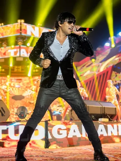 A powerful shot of me on the massive stage at the Tajpur festival. The scale of this public event was unbelievable.