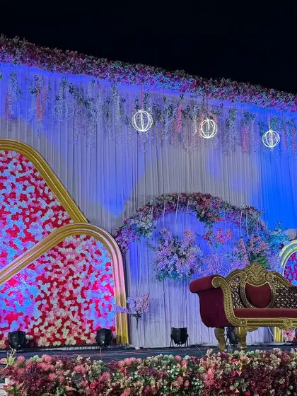 An angled view of the modern red and white floral stage, showing the depth and texture of the design.
