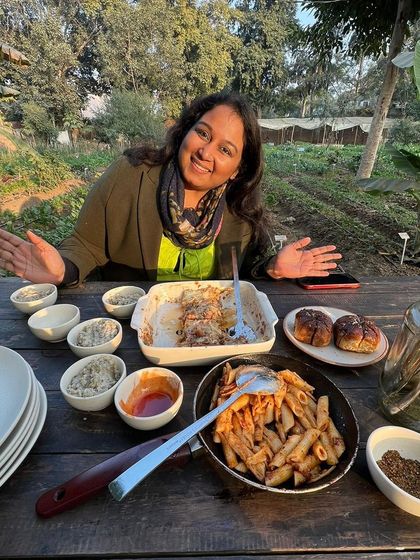 A happy guest enjoying a beautiful spread at one of our farm dining events. We love creating a relaxed, welcoming atmosphere where you can simply enjoy good food and good company.