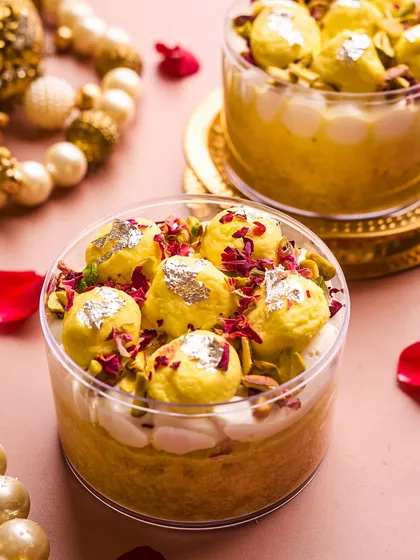 My Rasmalai Tres Leches is where Indian tradition meets global indulgence. I soak a moist vanilla cake in a saffron and cardamom milk blend, layer it with Belgian white chocolate mousse, and top it with baby rasmalais and pistachios.