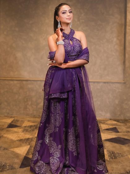 This purple lehenga is the perfect outfit for our dramatic purple winged liner. The entire look is coordinated, fashionable, and absolutely stunning.