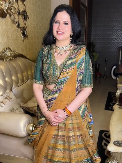 Another shot of the gorgeous mother of the bride, looking absolutely stunning and ready for the wedding festivities.