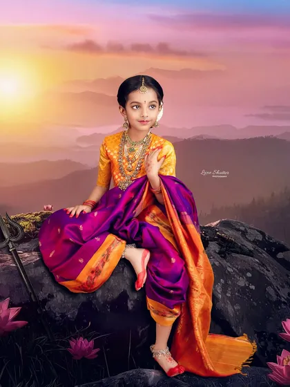 Celebrating the little Lakshmi at home. This stunning, composite portrait for Varalakshmi Pooja places the child in a divine, mountainous landscape at sunset.