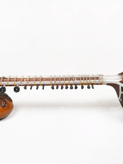A full-length studio photograph of a Pandit Ravi Shankar style sitar. This view showcases the complete instrument, highlighting its proportions and beautiful craftsmanship.